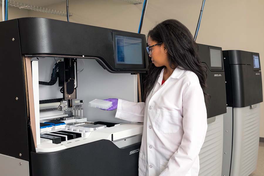 Scientist in lab with Sequel system close-up